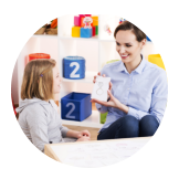 adult female playing cards with a kid
