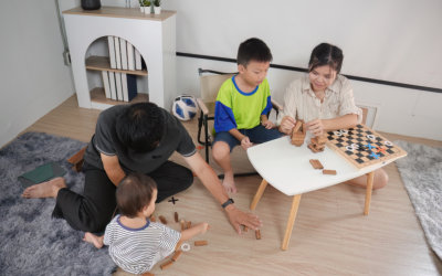 three kids and an adult playing