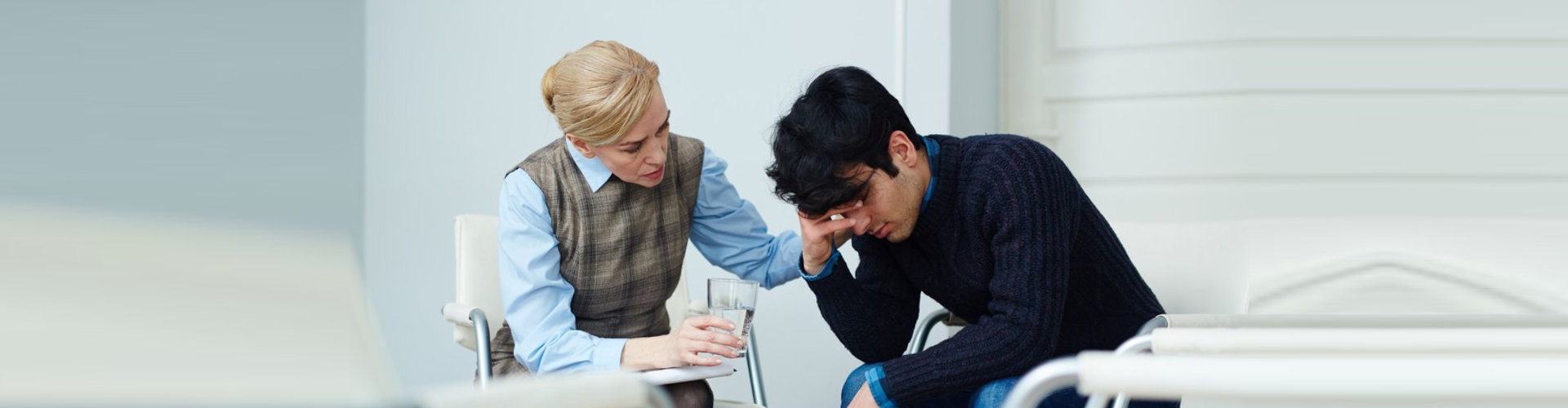 therapist comforting her client