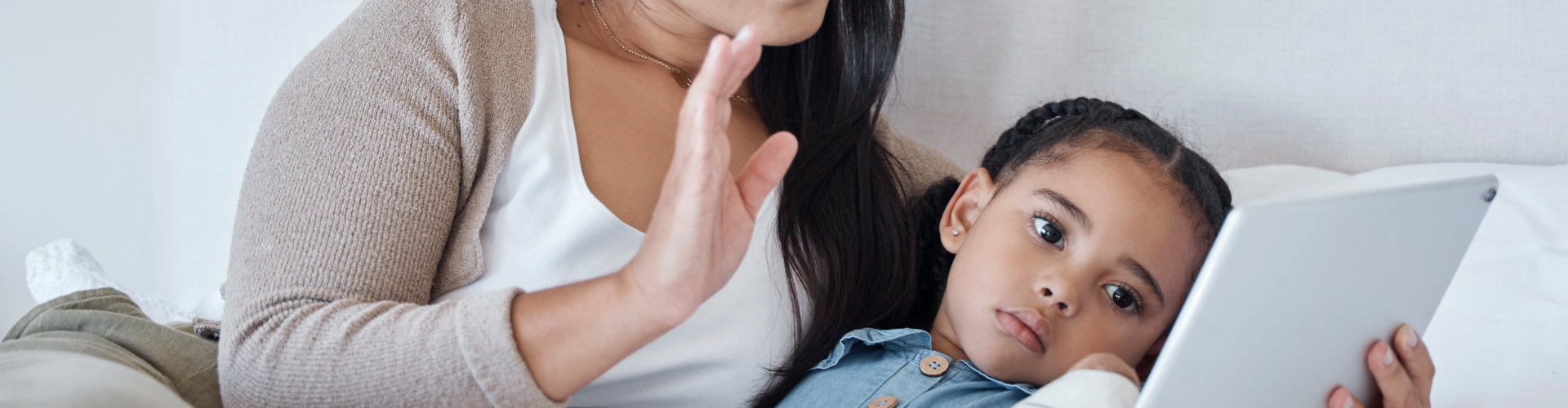 woman and her kid watching on a tablet
